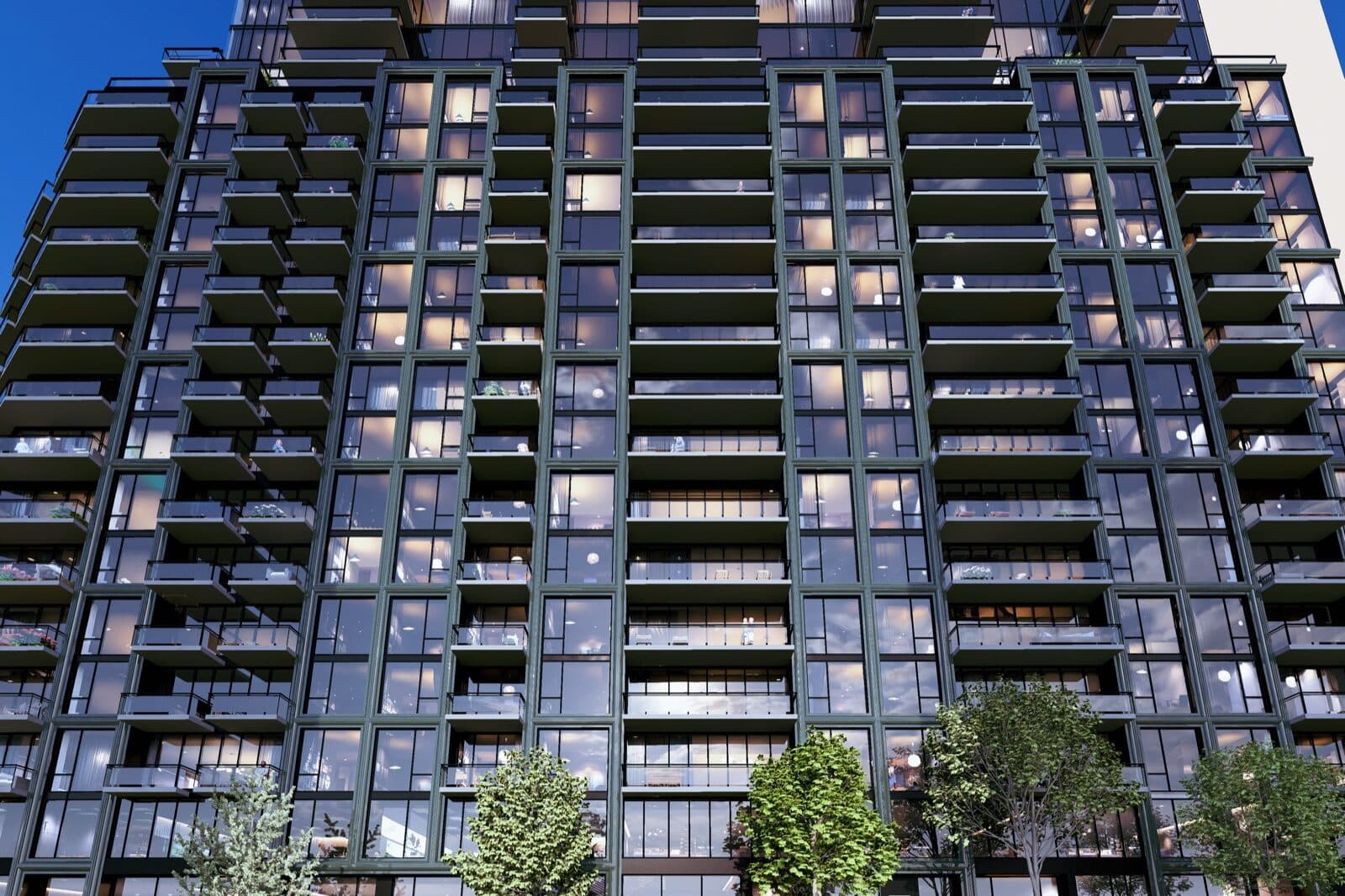 Close view of the Luma Living facade at dusk